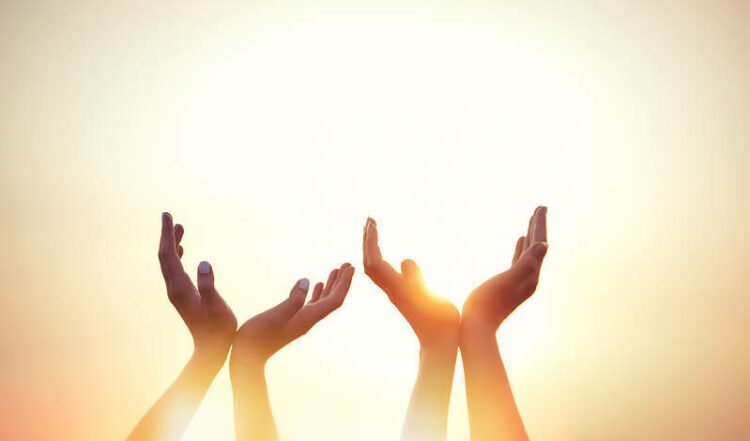 Thanksgiving: Four hands on sunset.Picture Credit: timesfreepress.com