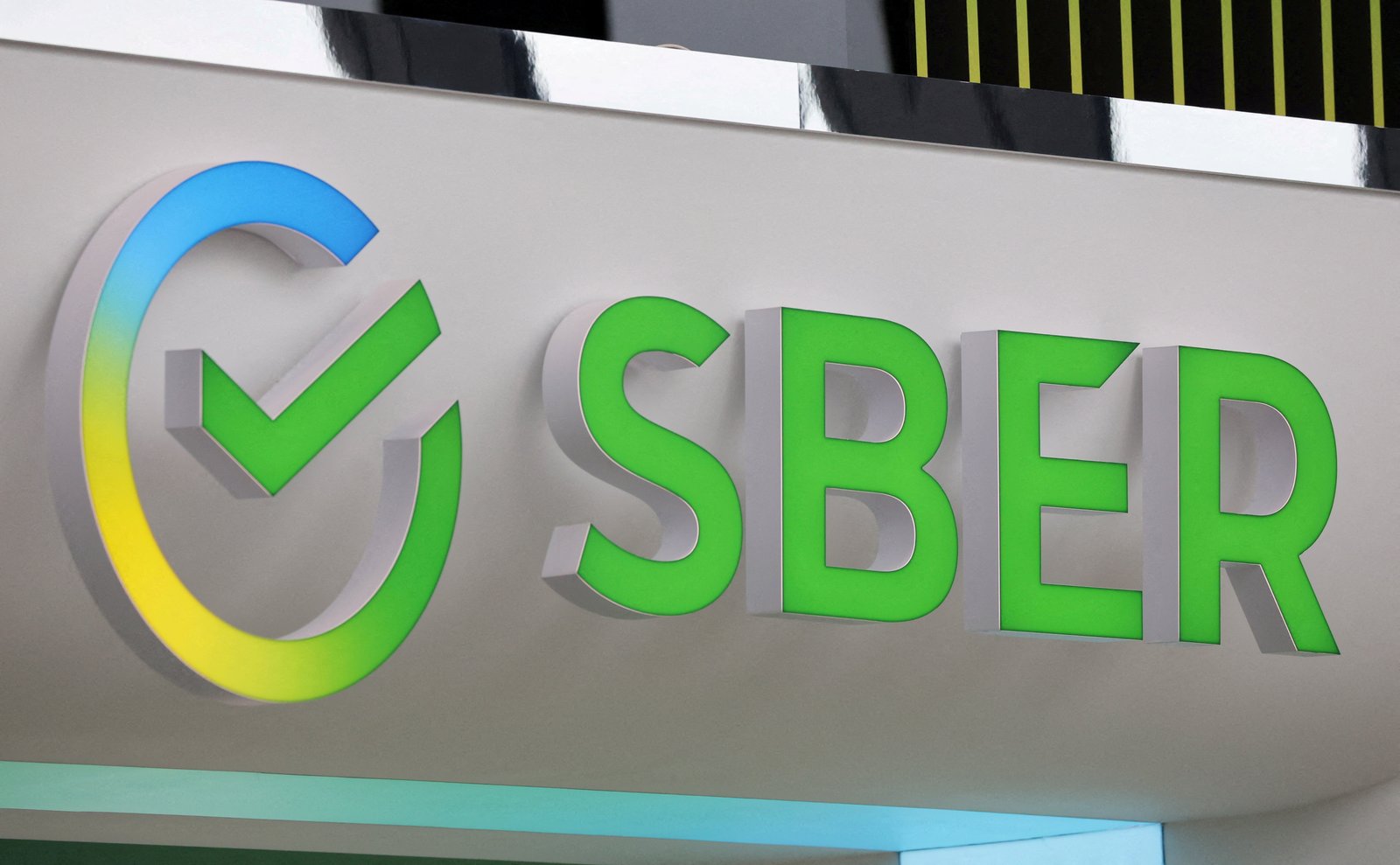 FILE PHOTO: A view shows the logo of Sber (Sberbank) at the St. Petersburg International Economic Forum (SPIEF) in Saint Petersburg, Russia June 15, 2022. REUTERS/Anton Vaganov/File Photo