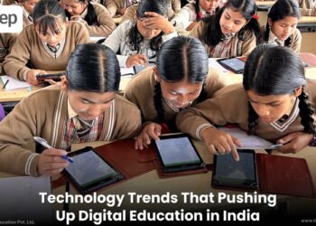 Image of students engaged in digital learning using tablets, exemplifying the  technology trends are elevating digital education in India