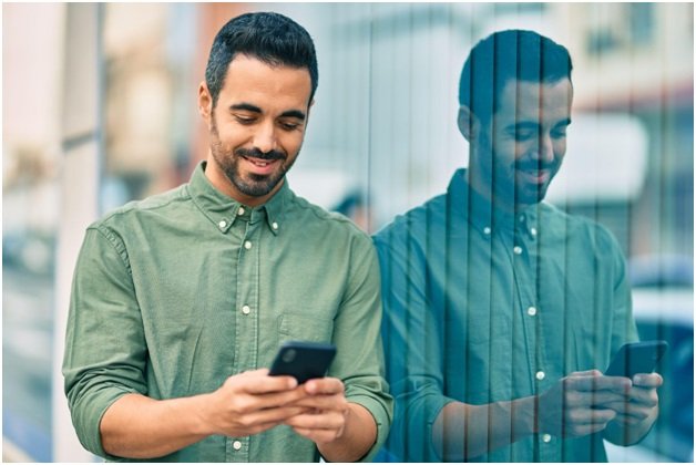 How to Switch Between Multiple eSIM Profiles on Your iPhone 2 phone use person