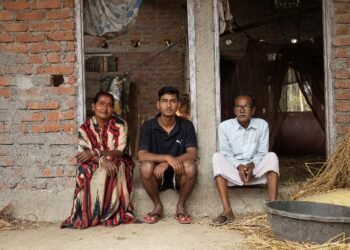 Priyabala Mondal with her family in Shalekura village, Barpeta District, Assam where perennial flooding has severely impacted their family and the entire community.