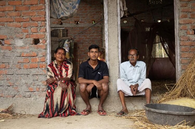 Priyabala Mondal with her family in Shalekura village, Barpeta District, Assam where perennial flooding has severely impacted their family and the entire community.