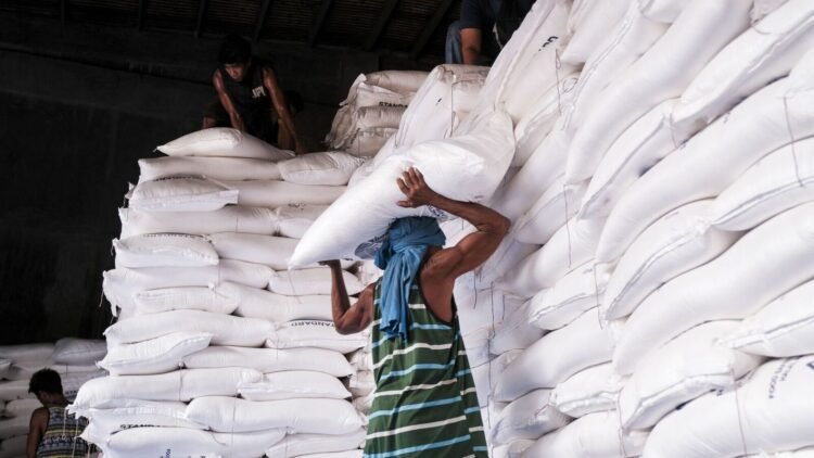 Workers handle sacks of refined sugar at a warehouse in Bacolod, the Philippines, on Tuesday, April 30, 2024. Philippine President Ferdinand Marcos Jr. has ordered the relaxation of rules on importation of agriculture products including sugar to stabilize prices. Photographer: Veejay Villafranca/Bloomberg