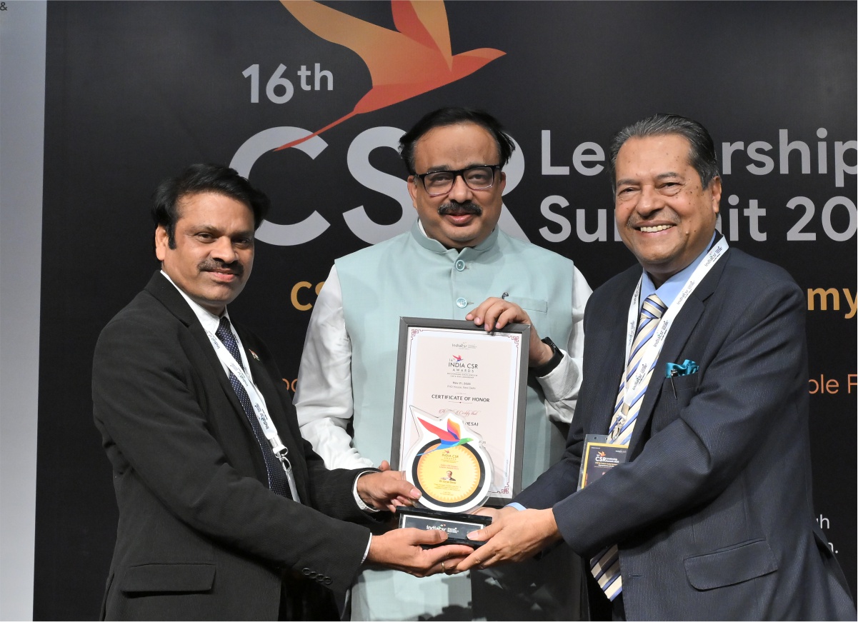Award being Presented by Dr. Bhaskar Chatterjee and Rusen Kumar for Transformative Contributions to Education, Governance, and Rural Development.