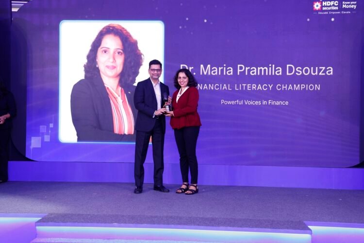 Dr. Maria Pramila Dsouza, Wealth2life receives the award from Unmesh Sharma, Head - Institutional Equities, HDFC Securities Limited