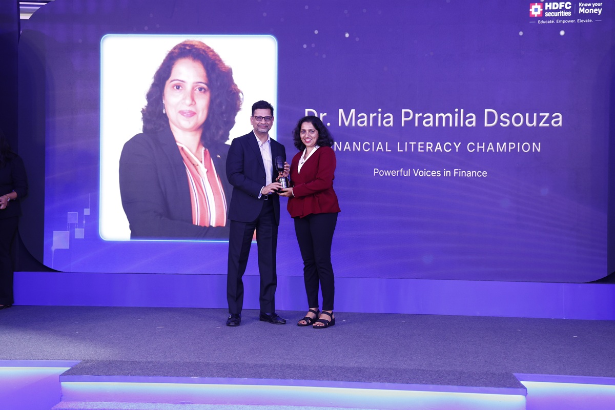 Dr. Maria Pramila Dsouza Honoured as Financial Literacy Champion at ‘Powerful Voices in Finance 2026' 1 Dr. Maria Pramila Dsouza, Wealth2life receives the award from Unmesh Sharma, Head - Institutional Equities, HDFC Securities Limited