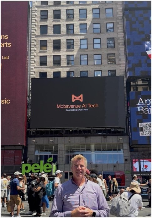 Mobavenue AI Launches Neural Engine, Introduces New Brand Identity 1 Mobavenue AI's new brand identity displayed at Times Square, New York, with Eric Lind, Country Head – United States.
